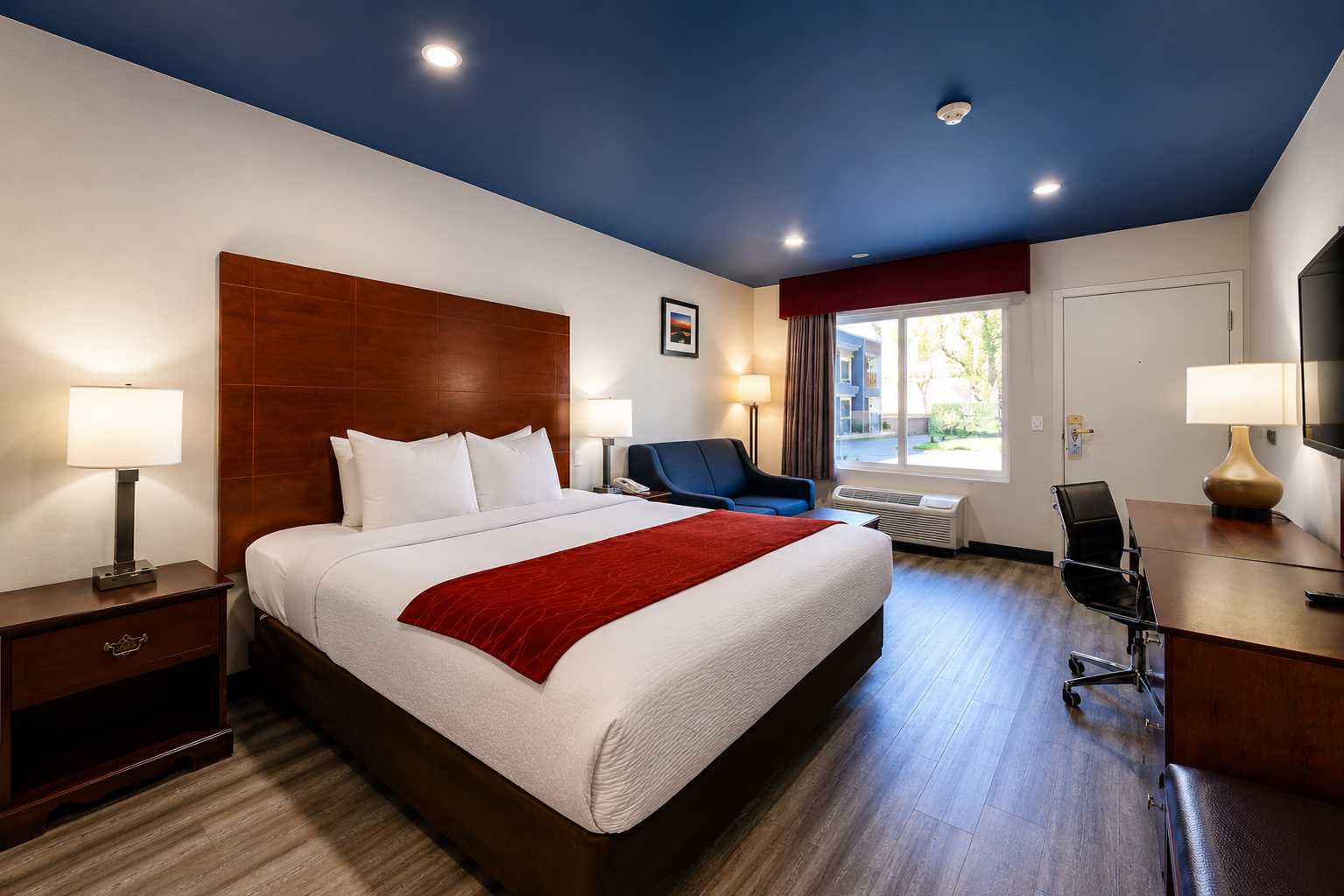 Fresh guest room with king bed at Hyland Inn